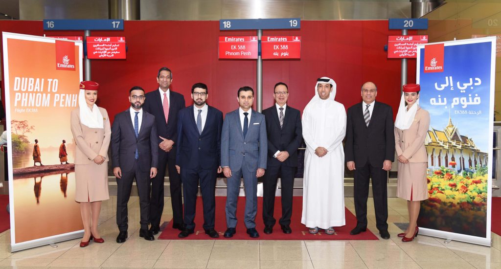 A typical scene - Female flight attendants flank male executives. Photo Credit: Emirates