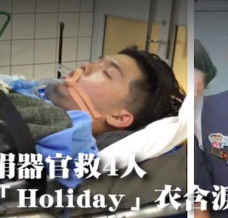 a man lying in a hospital bed