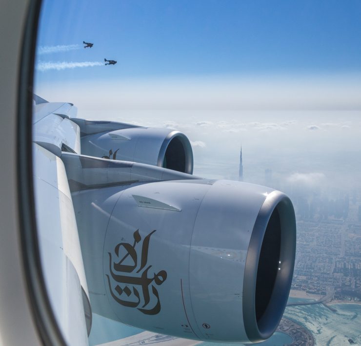 a plane engine with a city in the background