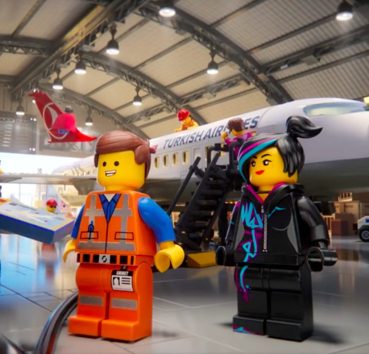 a group of toy people in a building