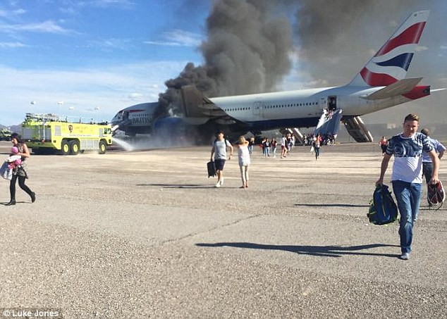Photo's taken during the evacuation of British Airways flight BA2276 at Las Vegas airport showed multiple passengers carrying hand luggage.