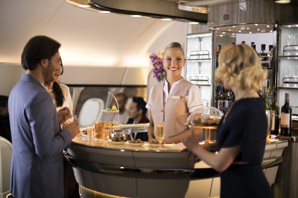 Airline publicity images like this one give the impression its perfectly fine to be stood up for prolonged periods during a flight. Photo Credit: Emirates