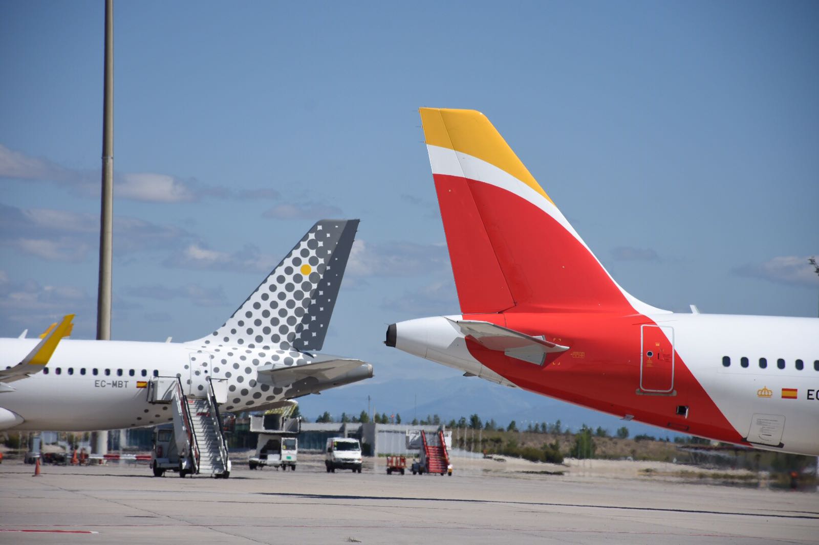 a group of airplanes on a runway