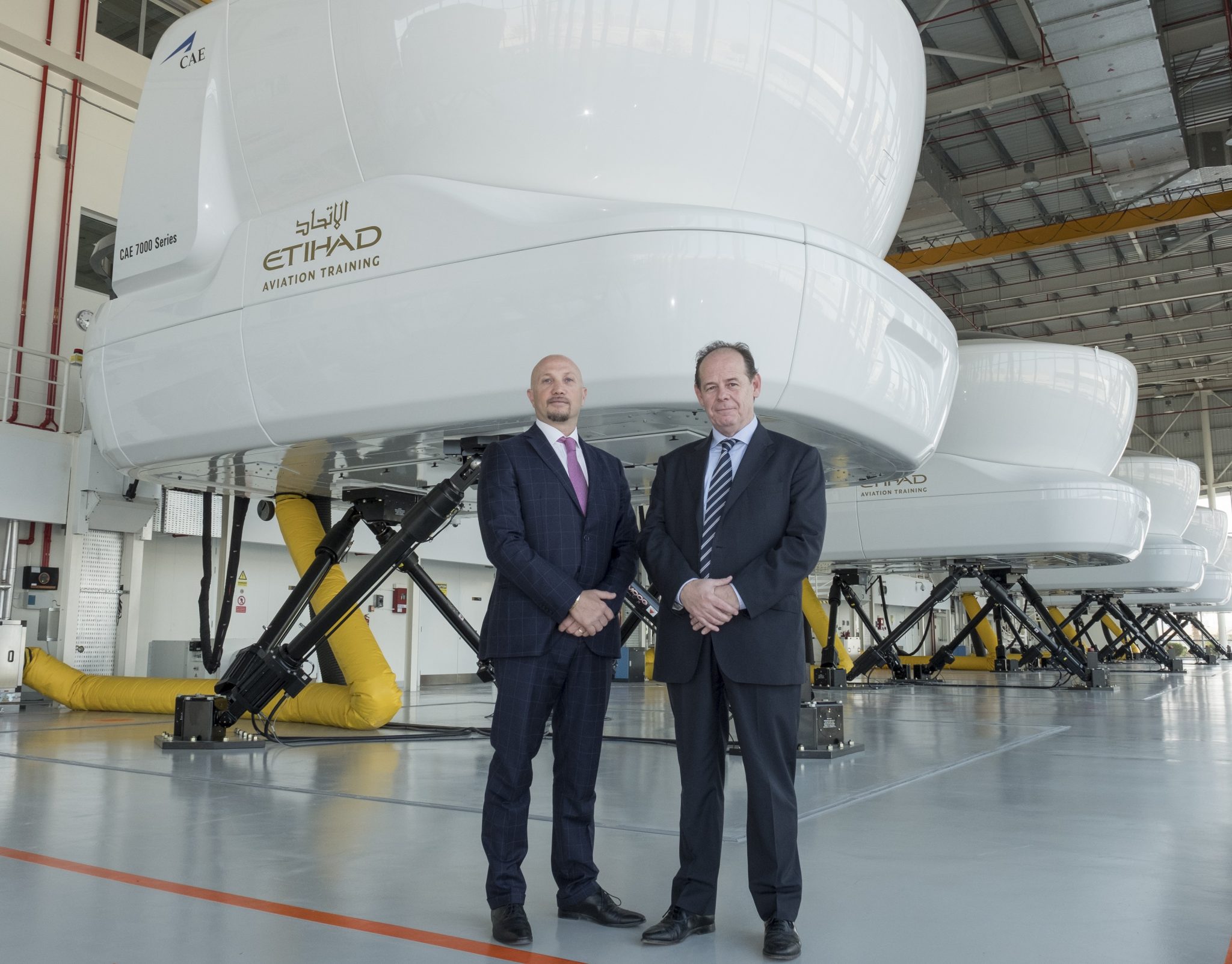 aptain Paolo La Cava, Director Etihad Aviation Training (left) with Chris Youlten, Managing Director Etihad Airport Services (right) at Etihad Aviation Training in Abu Dhabi.
