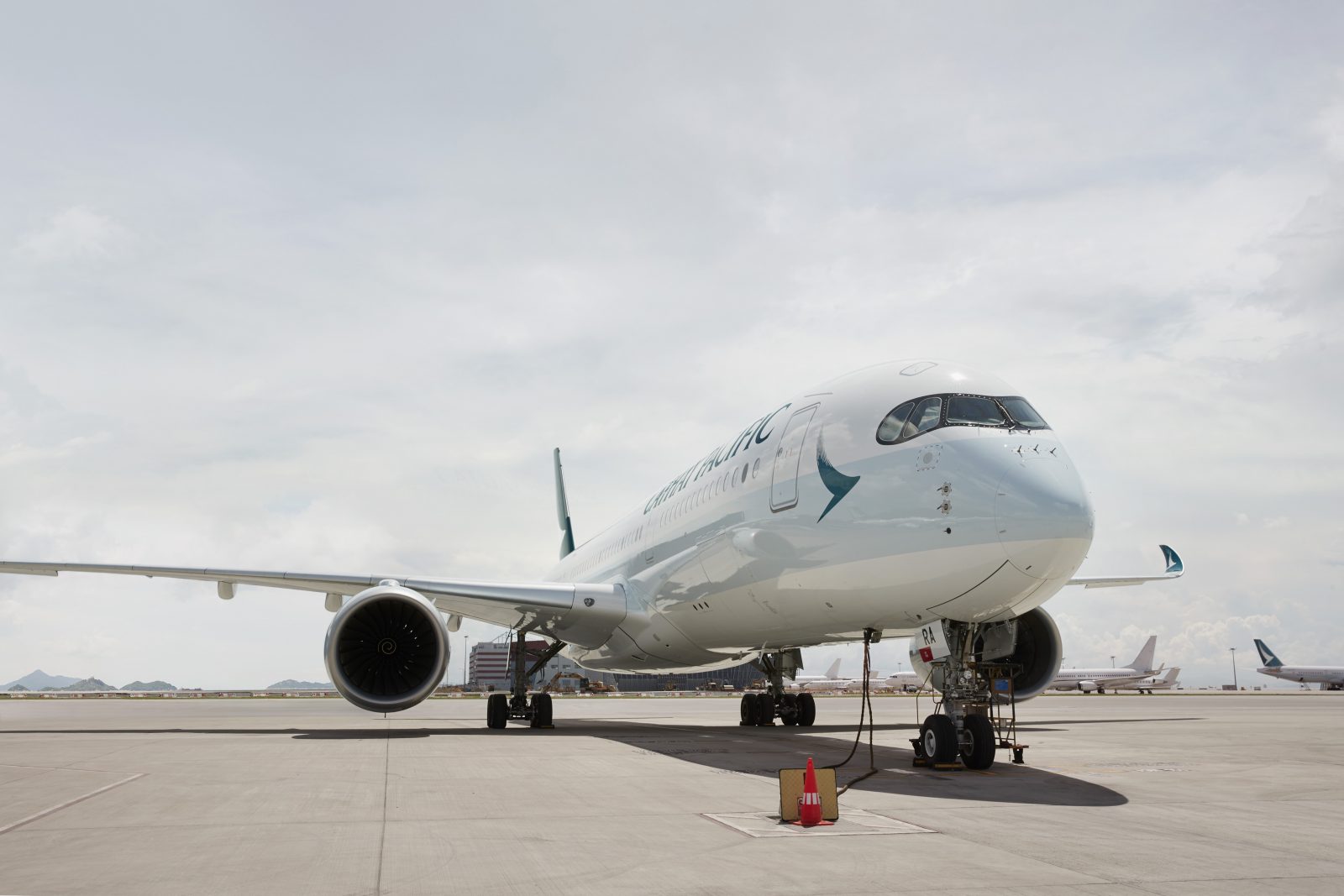a white airplane on a runway