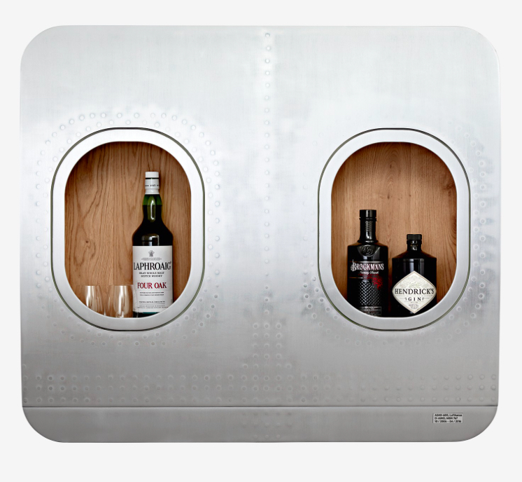 a two bottles of alcohol in a plane window