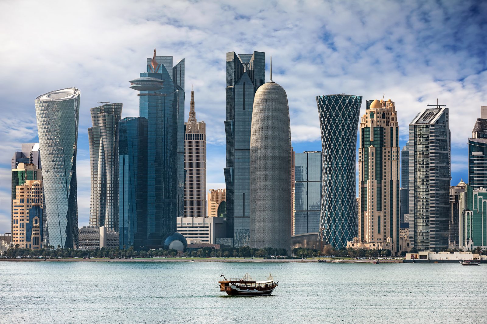 a city skyline with tall buildings in the background