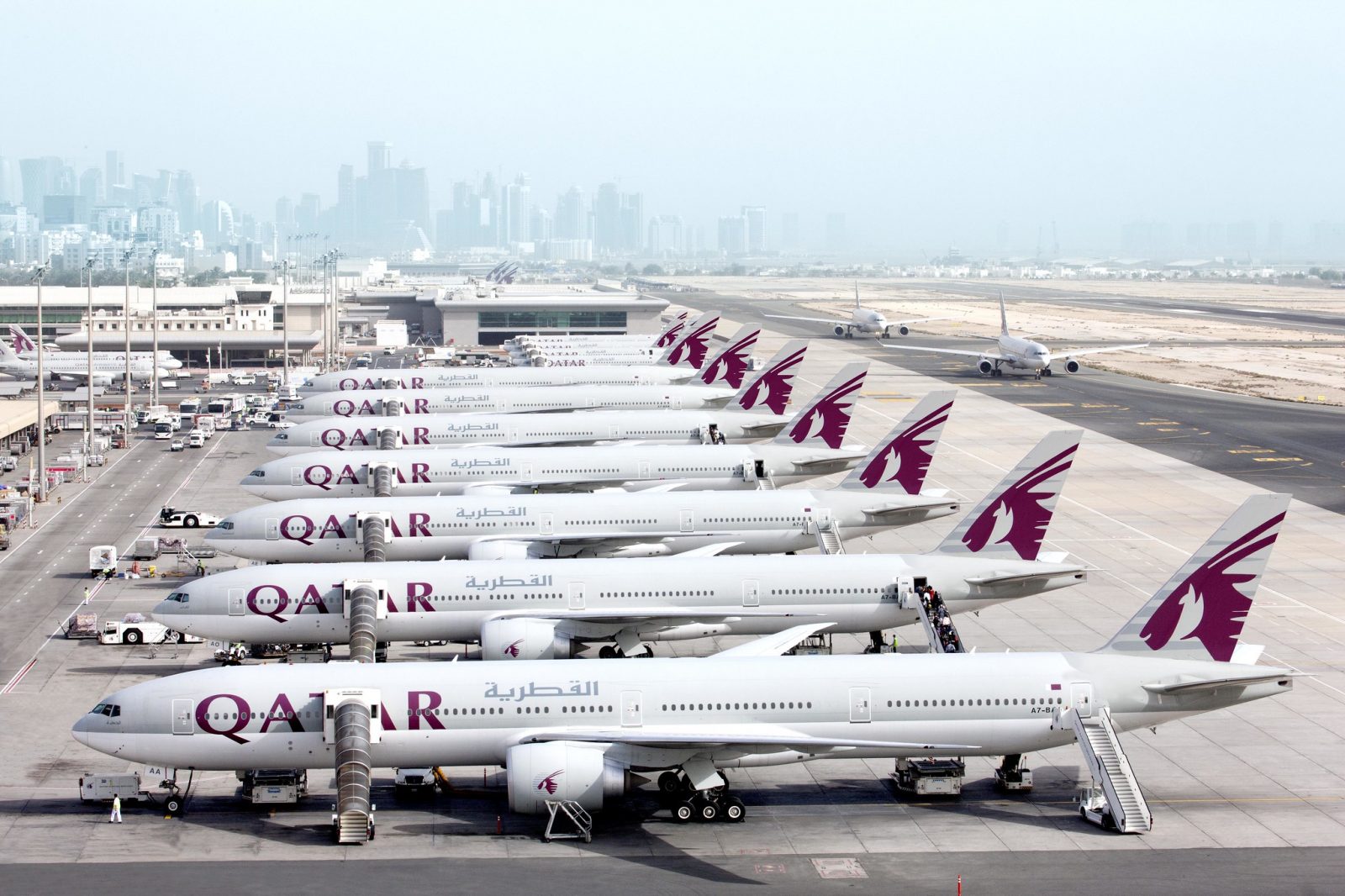 a group of airplanes parked on a runway