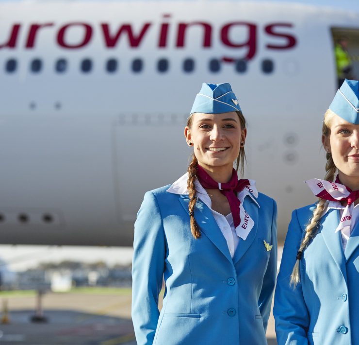 a group of women wearing blue uniforms and hats