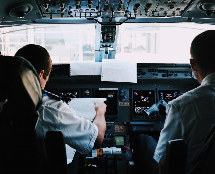 a group of men in a cockpit
