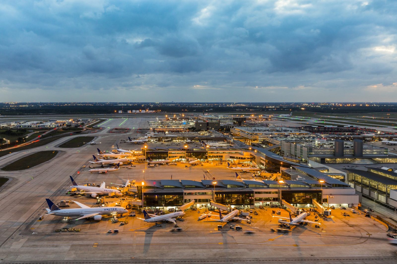 an airport with airplanes parked on the ground