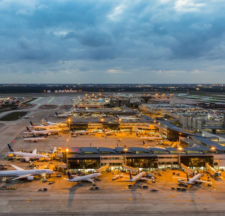 an airport with airplanes parked on the ground