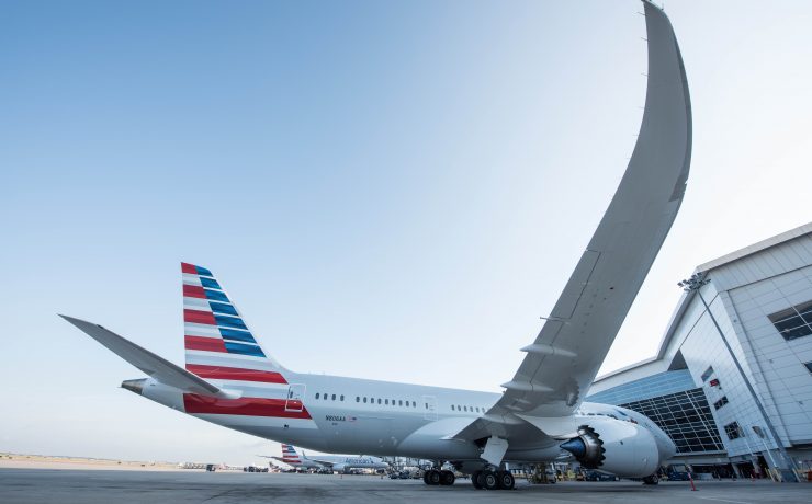 a large airplane with a red and white stripe on it