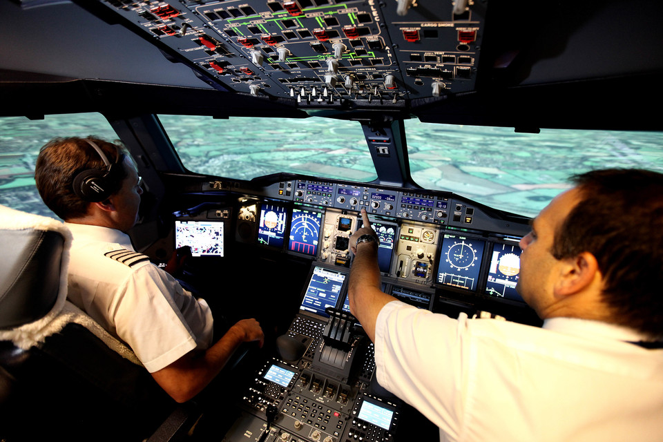 a pair of pilots in a cockpit