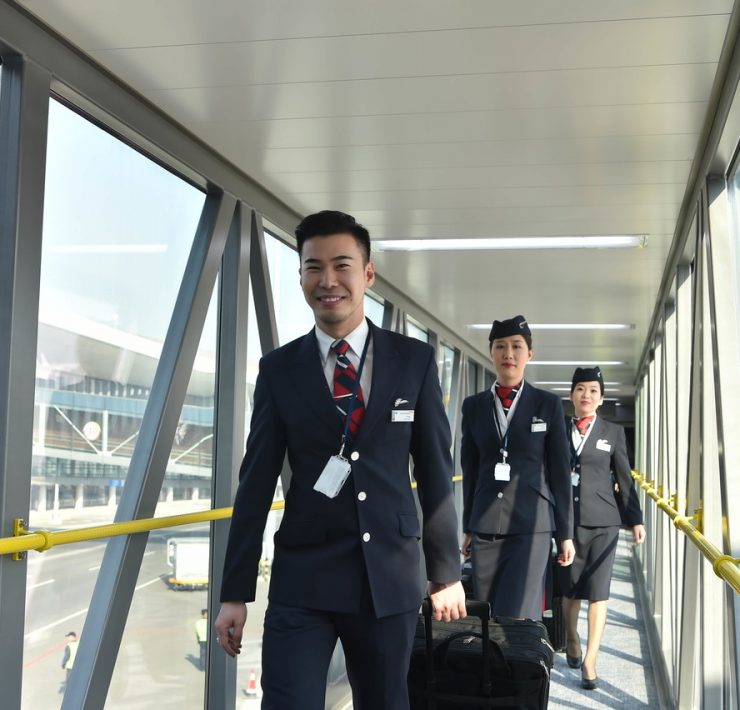 a group of people walking on a bridge