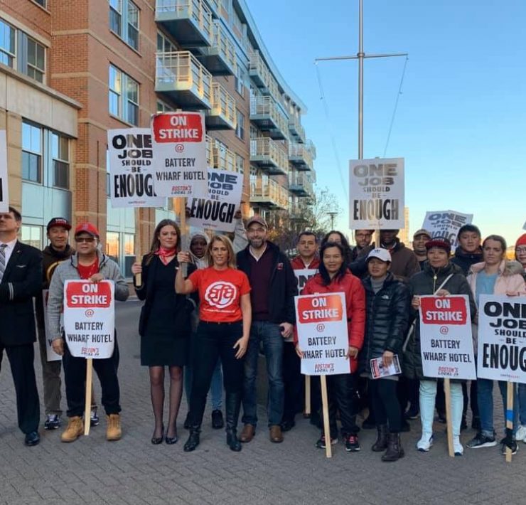 a group of people holding signs
