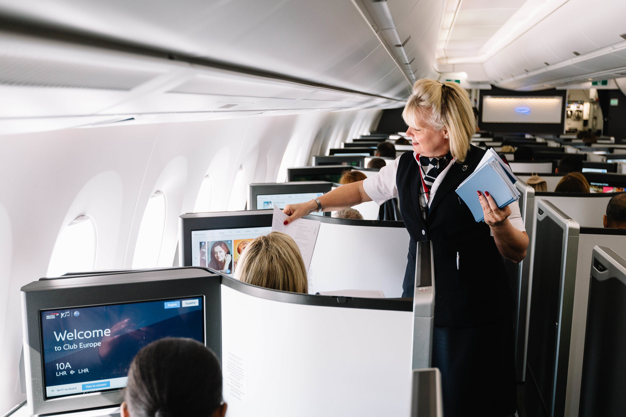 a woman standing in an airplane