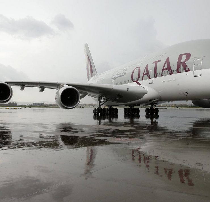 a large airplane on a wet runway