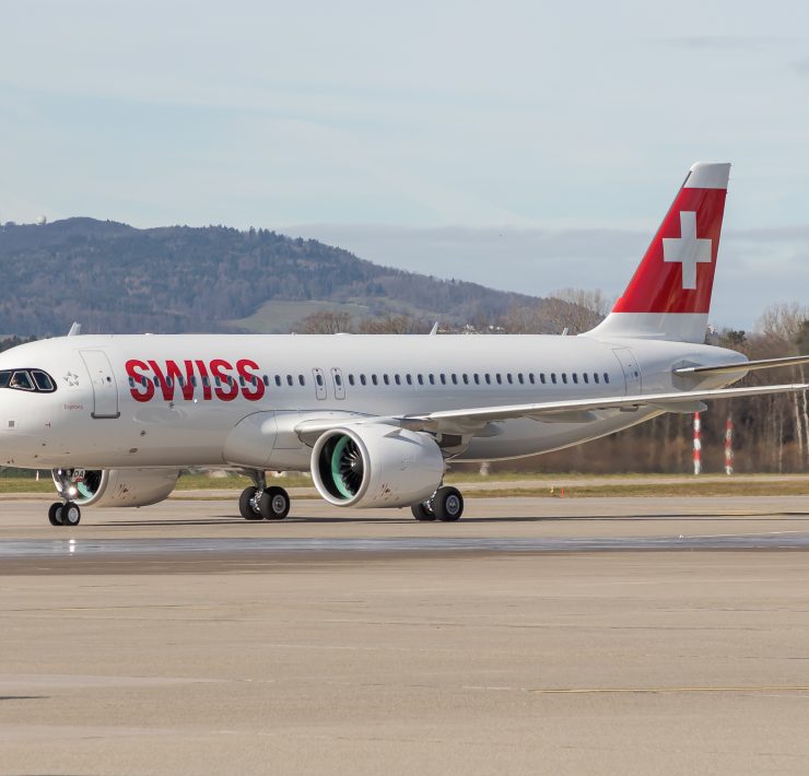 a white airplane on a runway