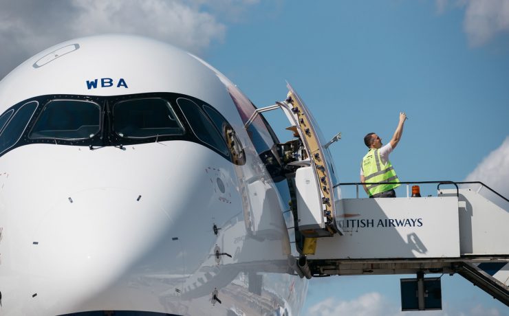 a man standing on a platform of a plane