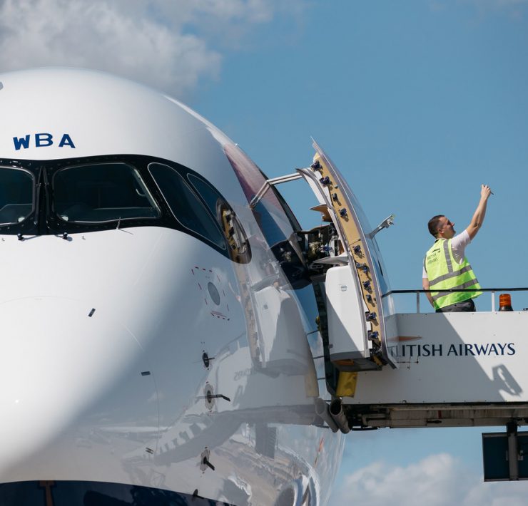 a man standing on a platform of a plane