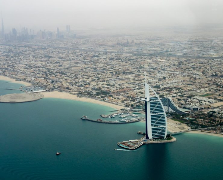 a tall building on a body of water