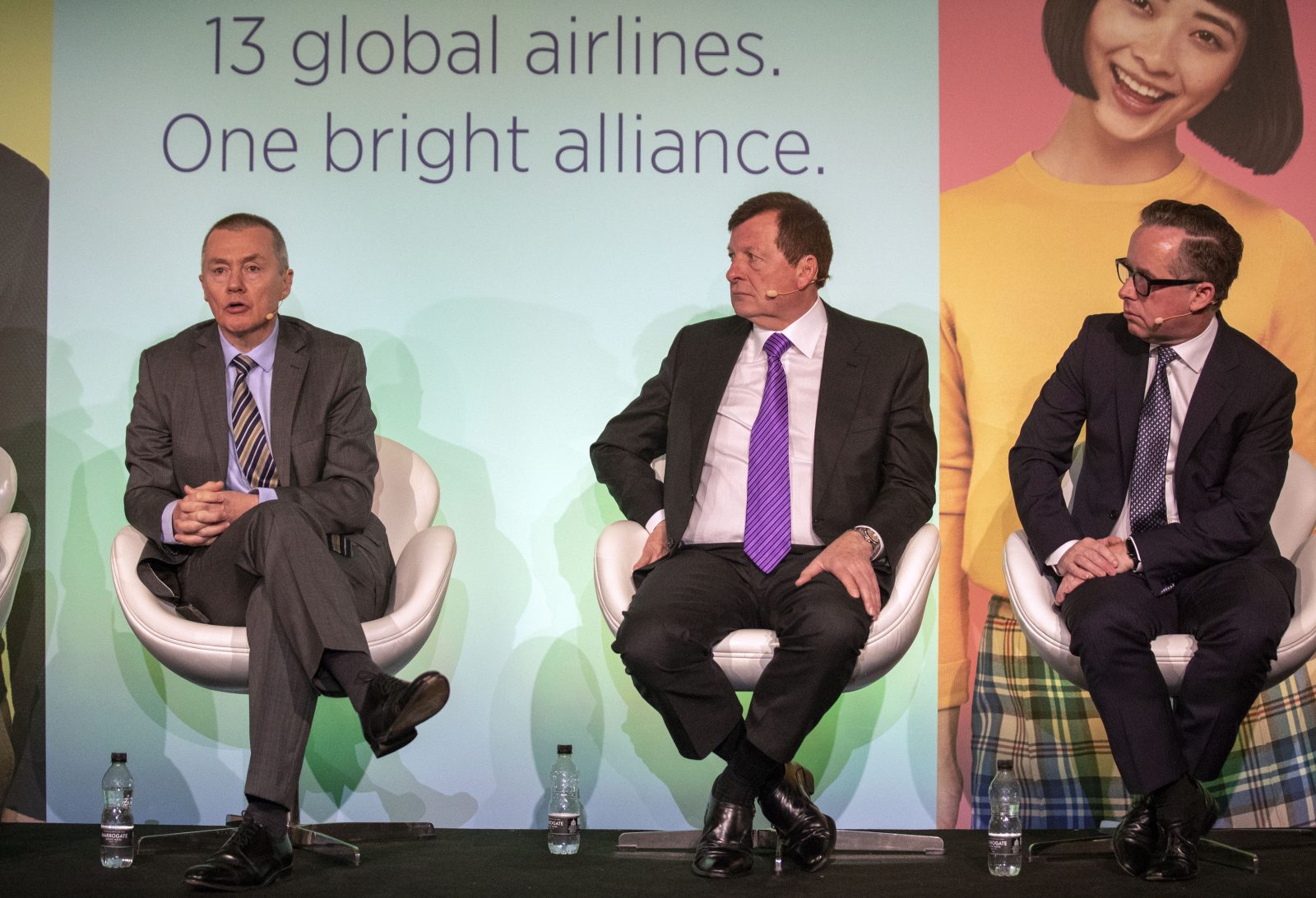 a group of men sitting on chairs