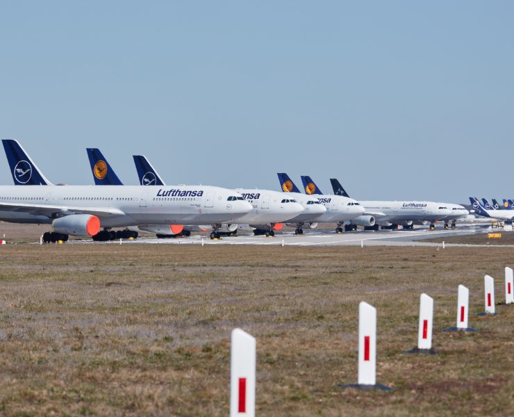 a row of airplanes on a runway