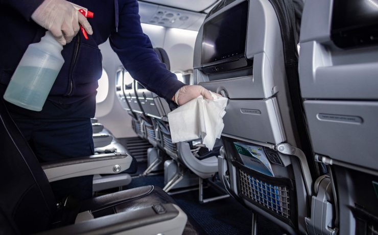 a person cleaning an airplane
