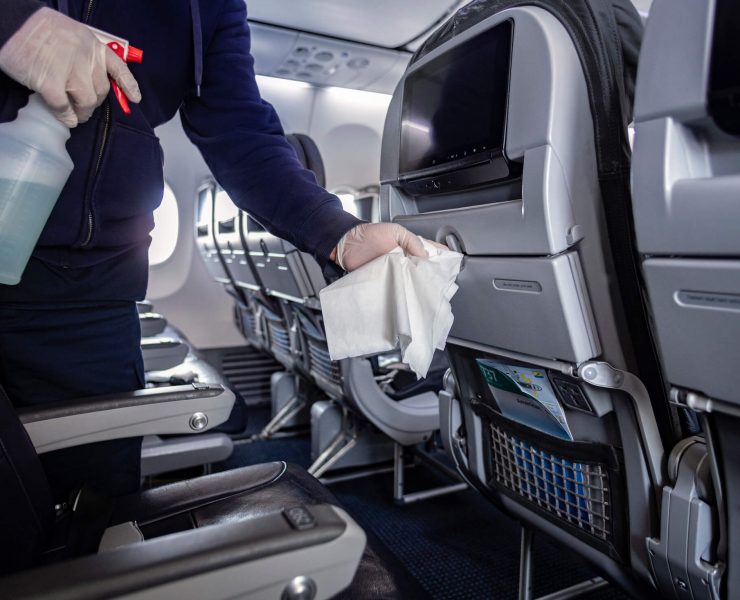 a person cleaning an airplane