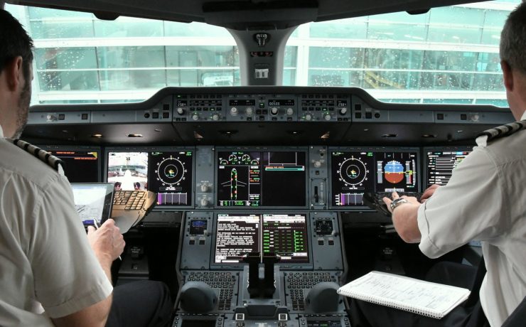 a man in a plane cockpit