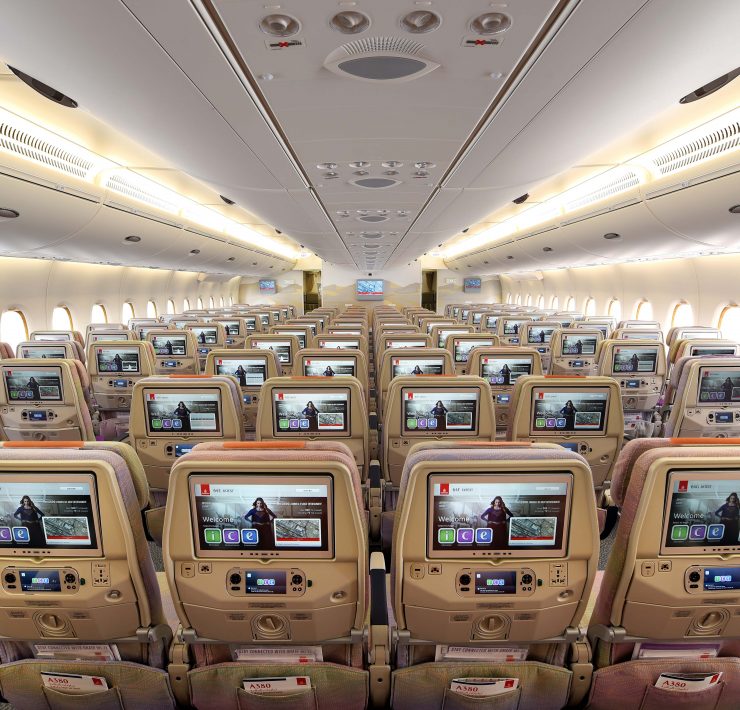 an airplane with many seats and monitors