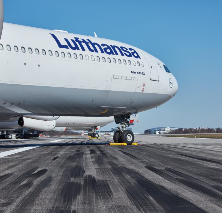 a large white airplane on a runway