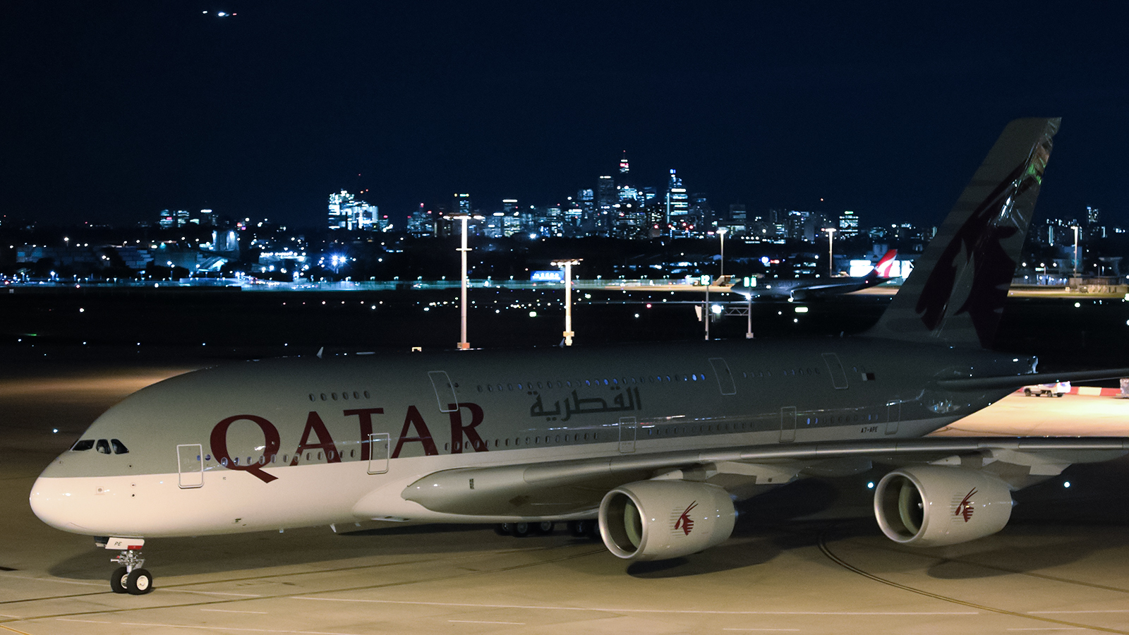 a plane on the runway at night