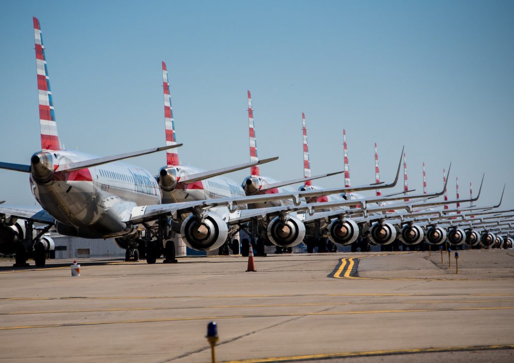 a row of airplanes on a runway