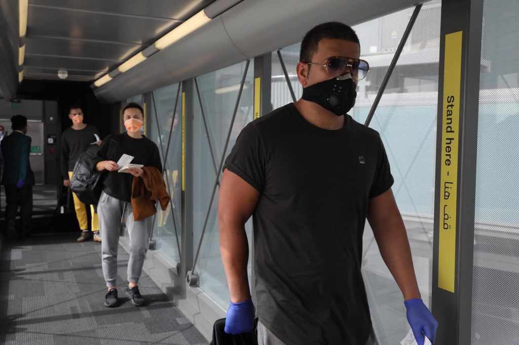 a man wearing a mask and gloves