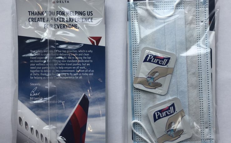 a package of hand sanitizer gels and a face mask