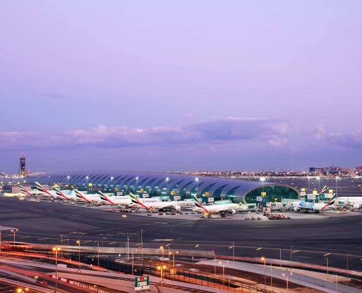 an airport with airplanes parked in the middle