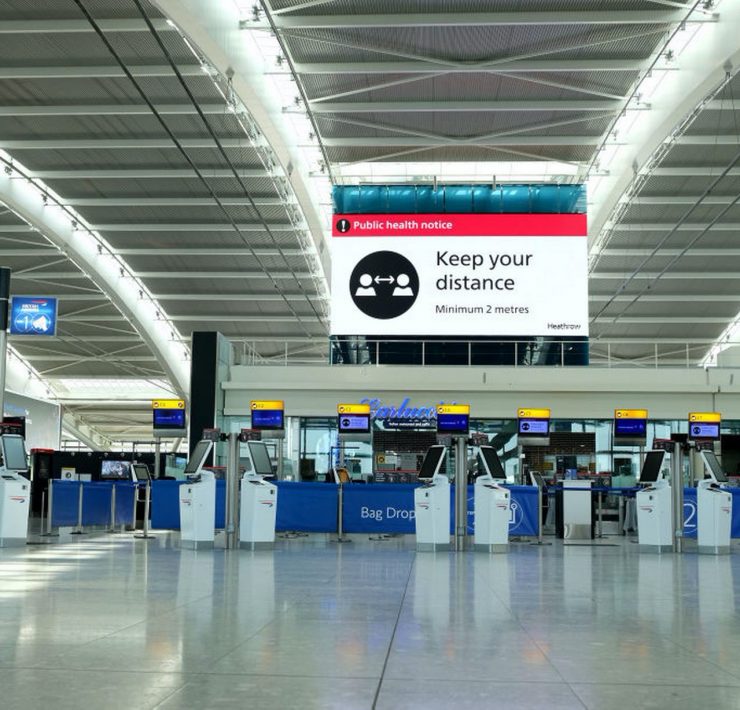 a large airport terminal with electronic equipment