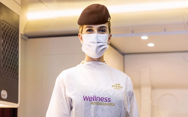 a woman wearing a mask and a brown hat