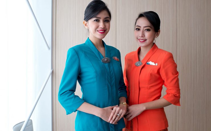 two women wearing matching outfits