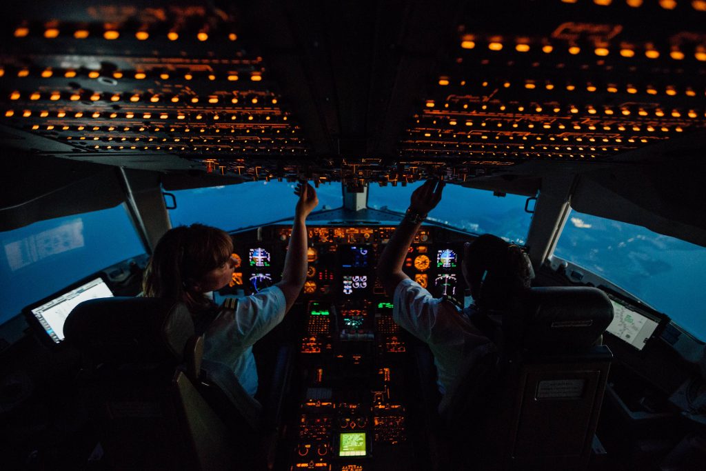 people in the cockpit of a plane