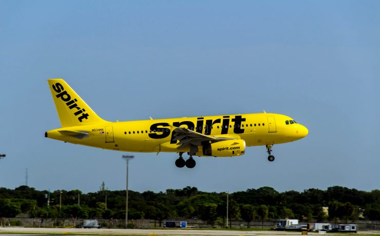 a yellow airplane taking off