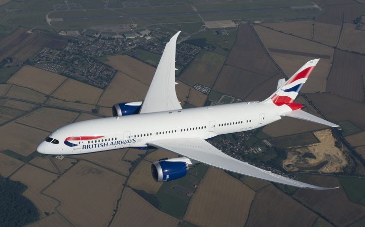 a white airplane flying in the sky