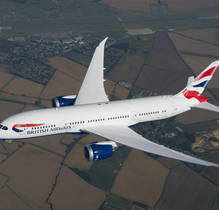 a white airplane flying in the sky
