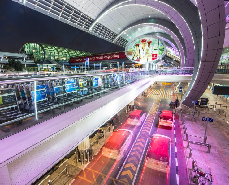 a large airport with a large building with a large sign