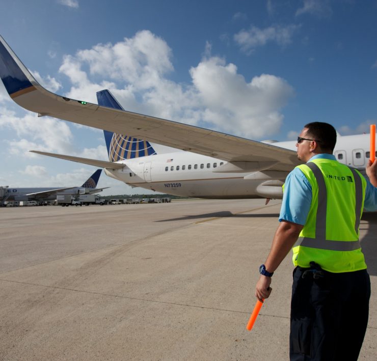 a man standing next to an airplane
