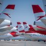a group of airplanes on a runway