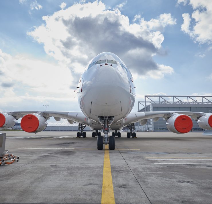 a large white airplane on a runway