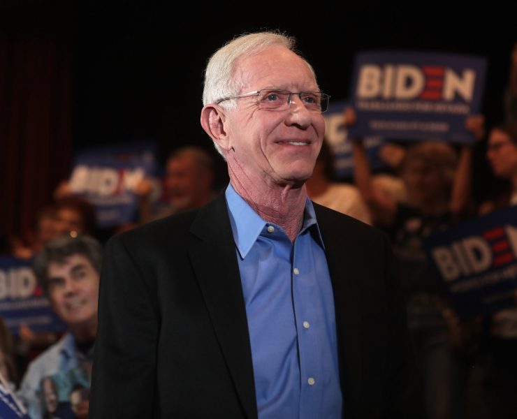 a man smiling at the camera